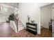 Entryway showcasing staircase, hardwood floors and access to living room, powder room and more at 510 Black Horse Cir, Canton, GA 30114