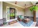 Inviting front porch with stone accents, comfortable seating, a 'Welcome' mat, and a decorated entrance at 510 Black Horse Cir, Canton, GA 30114