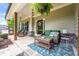 Inviting front porch with stone accents, comfortable seating, and a welcoming entrance, ferns, and hanging lanterns at 510 Black Horse Cir, Canton, GA 30114
