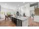 Open concept kitchen with granite island, stainless steel appliances, and eat-in dining area at 510 Black Horse Cir, Canton, GA 30114