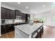 Elegant kitchen featuring granite countertops, stainless steel appliances, and breakfast bar seating at 510 Black Horse Cir, Canton, GA 30114