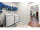 Bright laundry room with new washer and dryer and shelving for ample storage at 510 Black Horse Cir, Canton, GA 30114