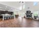 Open-concept living room with a fireplace, stainless steel appliances, and a large dining table at 510 Black Horse Cir, Canton, GA 30114