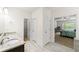 Bathroom with double sinks and a view into the main bedroom and walk in closet at 510 Black Horse Cir, Canton, GA 30114