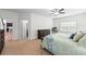 Well-lit main bedroom features new carpet, ceiling fan, a dresser, and an adjacent bathroom and closet at 510 Black Horse Cir, Canton, GA 30114