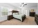 Bright main bedroom with carpet, a ceiling fan, and views into the bathroom and walk in closet at 510 Black Horse Cir, Canton, GA 30114