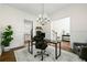 Stylish home office with hardwood floors, natural light, and a modern chandelier at 510 Black Horse Cir, Canton, GA 30114