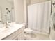 Clean bathroom with a tub-shower combination, a vanity, and butterfly wall art at 605 Oak Ln, Canton, GA 30114
