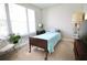 Serene bedroom with a cozy bed, large windows, and a tranquil atmosphere at 605 Oak Ln, Canton, GA 30114