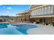 Inviting pool area with comfortable seating and views of surrounding homes at 605 Oak Ln, Canton, GA 30114