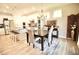 Bright dining room with modern lighting and wood floors at 605 Oak Ln, Canton, GA 30114