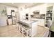 Spacious kitchen featuring a large island with seating and stainless steel appliances at 605 Oak Ln, Canton, GA 30114