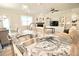 Open concept kitchen and living room with stainless steel sink and fireplace at 605 Oak Ln, Canton, GA 30114