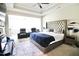 Spacious main bedroom suite with a luxurious upholstered headboard and a sitting area at 605 Oak Ln, Canton, GA 30114