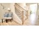 Elegant staircase with wood treads, black railings, and stylish decor at 605 Oak Ln, Canton, GA 30114