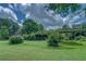 Spacious backyard featuring a covered area and ample green space for recreation and relaxation at 1830 Francis Sw Rd, Conyers, GA 30094