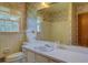 Bathroom featuring floral wallpaper and a large mirror at 1830 Francis Sw Rd, Conyers, GA 30094