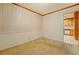Dining room with light colored carpet, wallpaper and access to the kitchen at 1830 Francis Sw Rd, Conyers, GA 30094