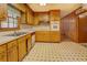 The kitchen boasts a white countertop, wooden cabinetry and modern appliances at 1830 Francis Sw Rd, Conyers, GA 30094
