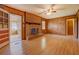 Cozy living room boasts a brick fireplace and wood paneled walls at 1830 Francis Sw Rd, Conyers, GA 30094