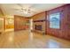 Inviting living room features a brick fireplace and wood paneled walls at 1830 Francis Sw Rd, Conyers, GA 30094