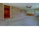 Spacious patio with brick wall and view into carpeted room at 1830 Francis Sw Rd, Conyers, GA 30094