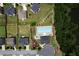 Aerial view of the neighborhood pool showcases its size and proximity to homes and a wooded area at 303 Horizon Trce, Loganville, GA 30052