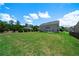 Spacious lawn featuring the back exterior of a two story house at 303 Horizon Trce, Loganville, GA 30052