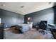Bedroom with gray walls, carpet flooring, a bed, a desk, and natural light from a window at 303 Horizon Trce, Loganville, GA 30052