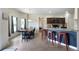 Open dining area next to the kitchen featuring dark wood furniture and natural light from windows at 303 Horizon Trce, Loganville, GA 30052