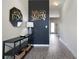 Stylish foyer with modern decor, a sleek console table, and attractive wall art at 303 Horizon Trce, Loganville, GA 30052
