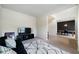 Open-concept living area with a comfortable sofa and view into the dining area at 303 Horizon Trce, Loganville, GA 30052
