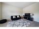 Cozy living room with a comfortable sofa, patterned rug, and media center at 303 Horizon Trce, Loganville, GA 30052