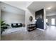 Inviting living space showcasing wood floors, carpeted living room, and a stylish accent wall at 303 Horizon Trce, Loganville, GA 30052