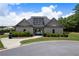 Attractive pool house features a stone archway, lovely landscaping, and a convenient location near the pool at 303 Horizon Trce, Loganville, GA 30052