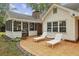 Backyard patio with a grill and two lounge chairs perfect for outdoor entertaining and relaxation at 4624 Stonehenge Dr, Atlanta, GA 30360