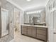 Beautiful bathroom showcasing vanity, mirrors and fixtures, with open doorway to separate toilet and shower area at 4624 Stonehenge Dr, Atlanta, GA 30360