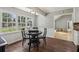 Charming dining area with backyard view and dark wood flooring at 4624 Stonehenge Dr, Atlanta, GA 30360