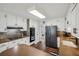 Functional kitchen with white cabinets, wood countertops, stainless steel appliances, and a tiled backsplash at 4624 Stonehenge Dr, Atlanta, GA 30360
