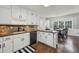 Well-lit kitchen boasts classic white cabinets and a dark countertop at 4624 Stonehenge Dr, Atlanta, GA 30360