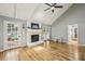 Bright living room with fireplace, French doors, and hardwood floors at 4624 Stonehenge Dr, Atlanta, GA 30360