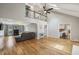 Open living space with high ceilings, hardwood floors, and a cozy sofa at 4624 Stonehenge Dr, Atlanta, GA 30360