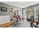 Comfortable office with hardwood floors, neutral walls, ample natural light, and a desk area at 4624 Stonehenge Dr, Atlanta, GA 30360