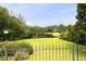 Well-manicured backyard overlooks a serene lake offering a peaceful escape at 5286 Wild Indigo Nw Way, Acworth, GA 30102