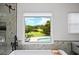 Bathroom with a view overlooking trees, a pool, with bright skies above that can be seen through the window at 5286 Wild Indigo Nw Way, Acworth, GA 30102