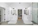 Elegant bathroom featuring dual vanities, sleek mirrors, and a glass-enclosed shower for a spa-like experience at 5286 Wild Indigo Nw Way, Acworth, GA 30102