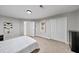 Comfortable bedroom with neutral walls, carpet flooring, and double door closet at 5286 Wild Indigo Nw Way, Acworth, GA 30102