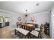 Charming dining room with modern lighting fixture and stylish decor, adjacent to an open kitchen area at 5286 Wild Indigo Nw Way, Acworth, GA 30102