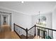 Grand entryway with hardwood floors, decorative chandelier, and a large window over the front door at 5286 Wild Indigo Nw Way, Acworth, GA 30102
