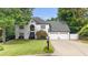 Charming two-story home with a manicured lawn and attached two-car garage at 5286 Wild Indigo Nw Way, Acworth, GA 30102
